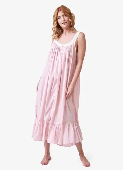Red haired model wearing pink cotton nightdress